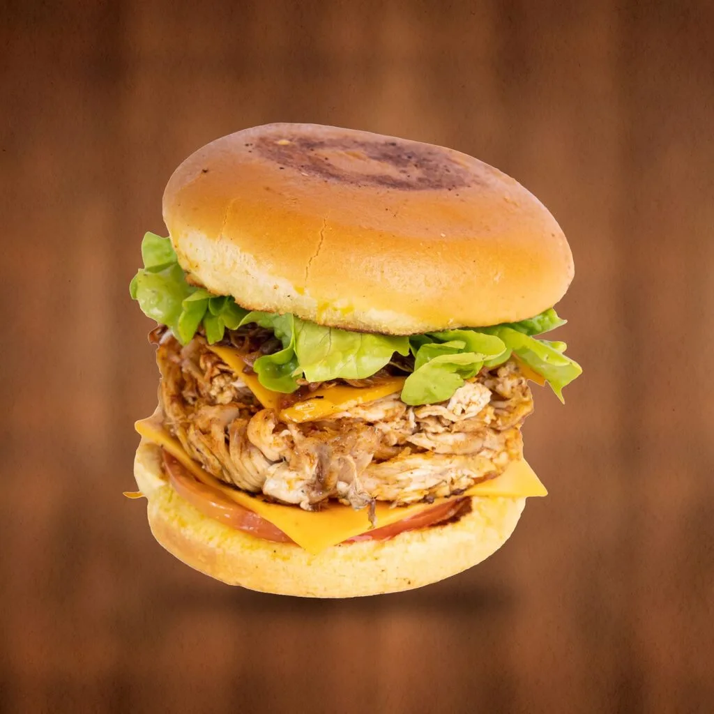 Big Chicken Burger - slow-cooked charcoal chicken with cheddar cheese, chili and BBQ ribs sauce on a golden bun